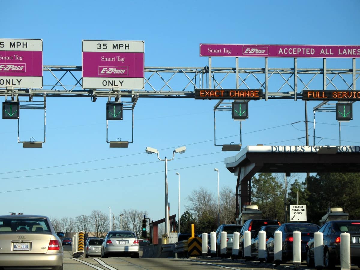 Toll plaza with overhead gantry signs, a variable message display and lane equipment